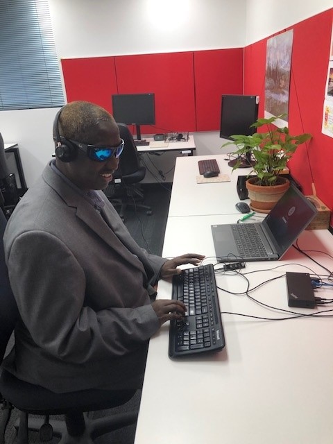 Systemic Advocate, Dr Siyat Abdi working on his computer