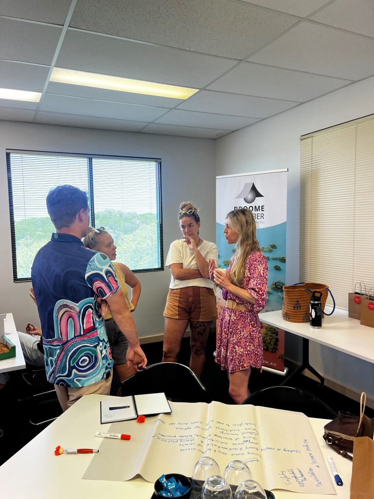 Image of Karen the Community of Practice Project Coordinator speaking to a group of support workers at one of the events.